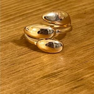 Gold tone triple wrap dome ring that wraps around the finger size 6 1/2